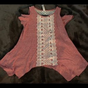 Cold shoulder short sleeve sweater. Swing hem.